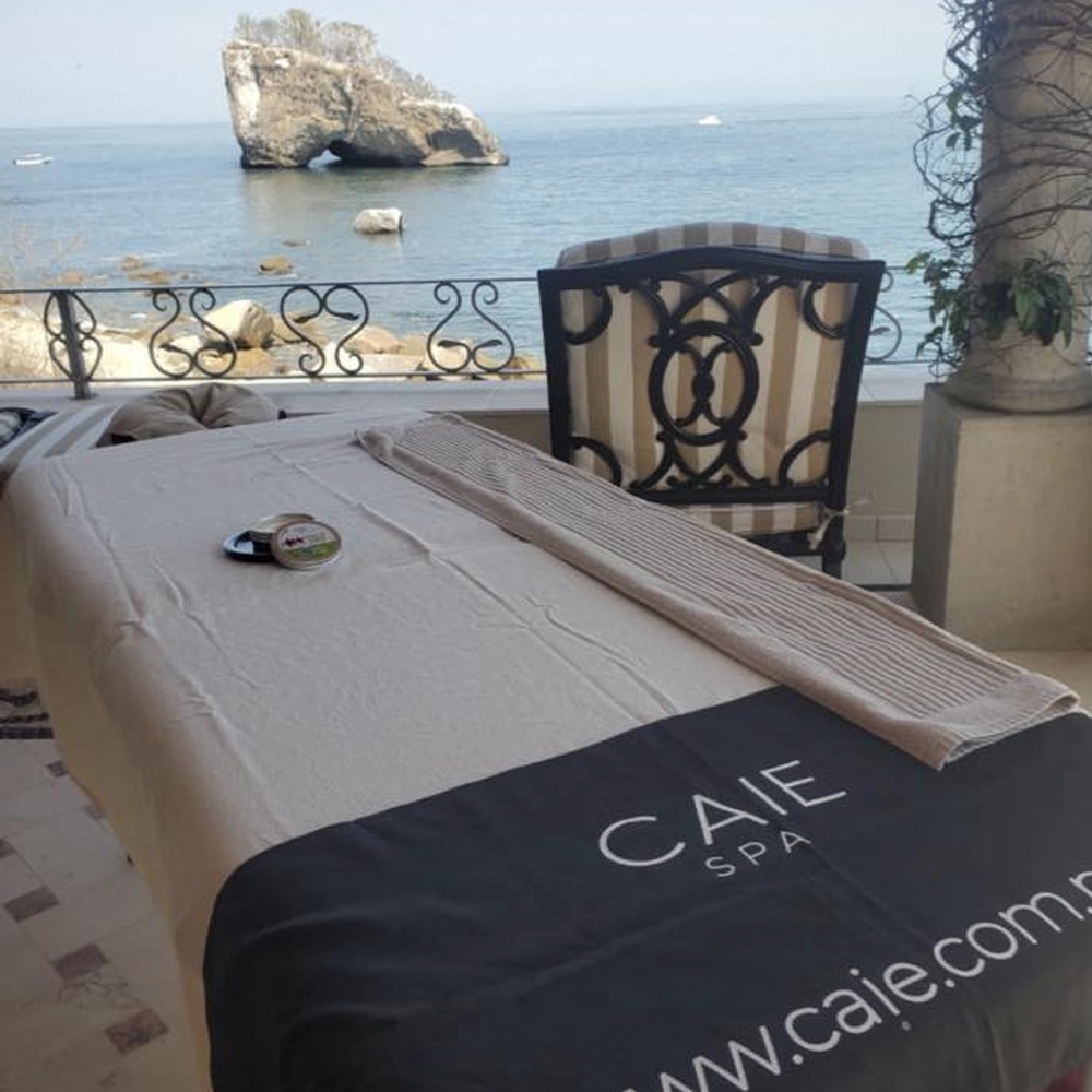 Massage by the ocean with relaxing aromatherapy and tropical breeze.